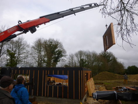 Grutage mur paille